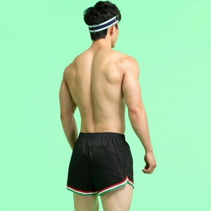 Rear view of black athletic shorts with red white green stripes and matching headband