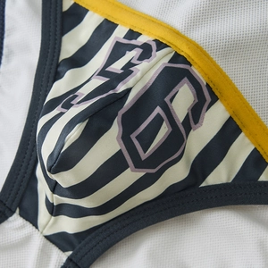 Close-up of men's low-rise briefs featuring breathable mesh fabric and printed number 68