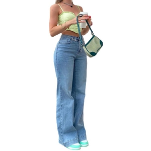 Detailed full view of high-waisted wide-leg denim jeans and light green ruffle crop top