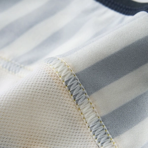 Close-up of men's low-rise briefs showing stripe mesh patchwork and reinforced stitching