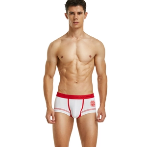 Detail view of men's knit boxer briefs with red festive belt and traditional pattern