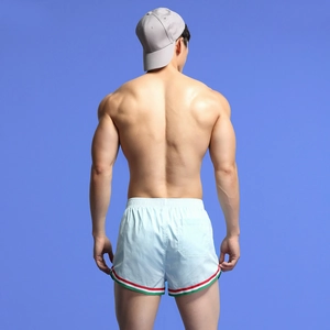 Rear view of light blue men's athletic shorts with tricolor stripes and grey cap