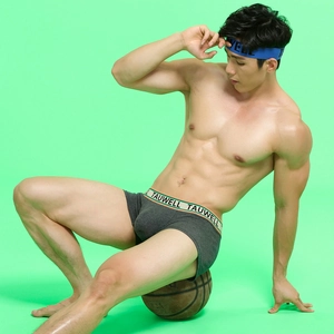 Detail of dark gray low-waisted boxer briefs and blue headband with athletic stripe accents