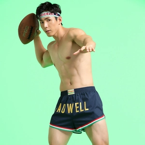 Men's navy sports shorts with elastic waist and stripes worn by a male athlete