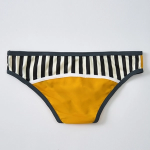 Detail view of honeycomb mesh fabric and black-white striped pattern on male briefs