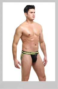 Close-up of men's jockstrap featuring breathable black mesh and a yellow elastic waistband