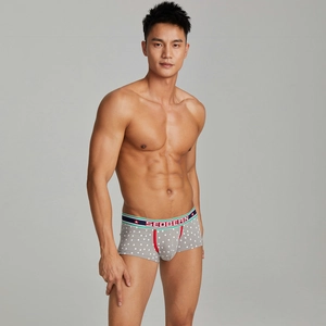 Detail of men's snowflake boxer briefs with colorful elastic waistband and U-pouch