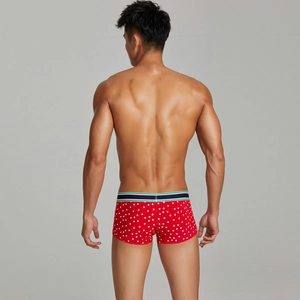 Rear view of men's red boxer briefs with snowflake print and striped elastic waistband