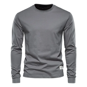 Detail view of grey long sleeve t-shirt showing the ribbed cuffs and hem woven label