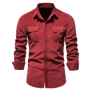 Detail of burgundy corduroy shirt featuring dual chest pockets with buttoned flaps