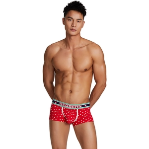 Men's red low-waist boxer briefs with white star patterns and wide elastic waistband