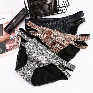 Detailed view of low waist men's briefs with faux snakeskin print and side cut-outs
