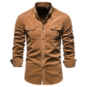 Detail of men's brown corduroy shirt with double chest pockets and button-down collar