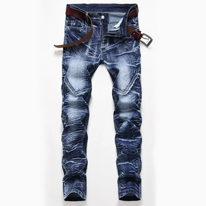 Detail of acid wash denim texture with 3D crinkle effects and a brown leather belt