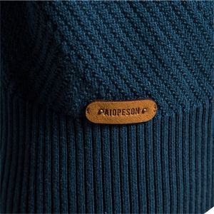 Men's peacock blue jacquard knit cardigan with stand collar and faux leather logo detail