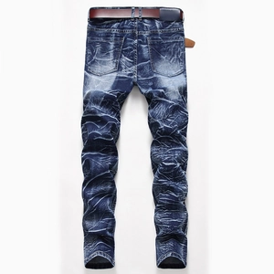 Detail of men's deep blue straight jeans with snowflake wash and vintage pleated texture