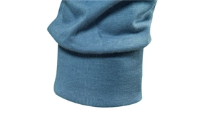 Detail of ribbed cuffs on cold blue-grey men's long sleeve knitted shirt fabric