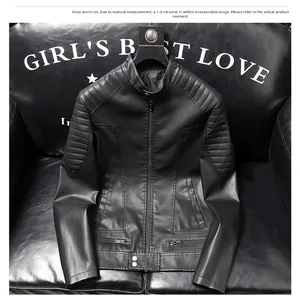 Detail of men's faux leather biker jacket with quilted shoulders and waist metal buckles