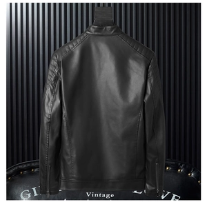 Detail view of motorcycle jacket showing quilted shoulder patterns and sleeve zippers
