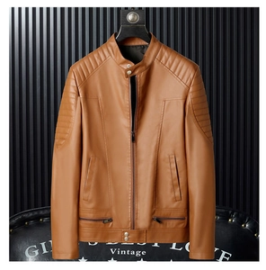 Detailed close-up of brown PU leather biker jacket featuring pleated shoulder padding