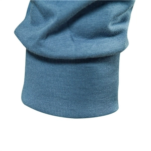 Close-up of ribbed cuffs on a men's long sleeve casual blue t-shirt in soft cotton