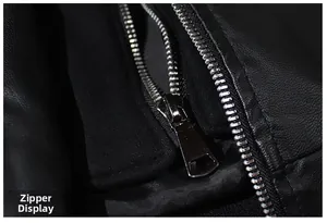 Close-up of high-quality silver metal zipper and black faux leather texture on jacket