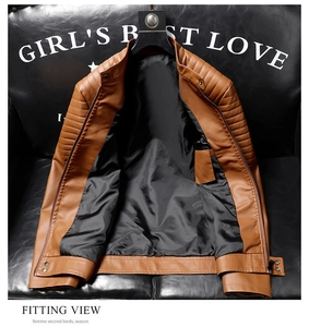 Detail view of brown faux leather jacket with quilted shoulders and metallic zipper