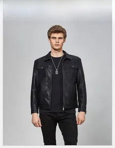 Detail of a slim-fit black PU leather jacket with lapel collar and twin chest flap pockets