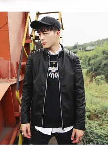 Close-up of quilted shoulder detail and silver zippers on a black faux leather moto jacket