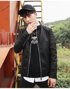 Detail of men's black PU leather jacket featuring ribbed shoulder panels and stand collar
