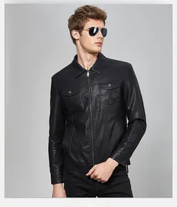 Close-up detail of black PU leather jacket featuring lapel collar and flap chest pockets