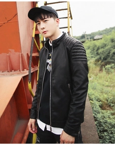 Detail of men's black PU leather jacket featuring stand collar and quilted shoulder stitching