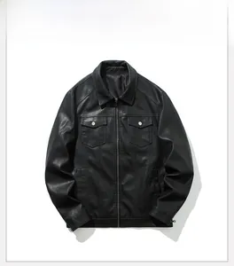 Close-up of black PU leather jacket texture with flap pockets and metal zipper detail