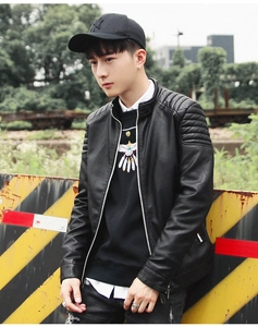 Detail of quilted shoulder stitching on black faux leather biker jacket for men