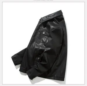 Detailed view of black PU leather jacket texture with lapel collar and silver button pocket