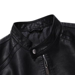 Detail view of leather jacket stand-up collar with metallic snap button and silver zipper