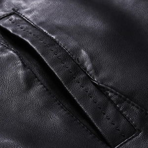 Close-up of premium black PU leather jacket showing detailed stitching and fine texture