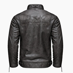 Macro view of vintage grey PU leather jacket showing embossed text and detailed stitching