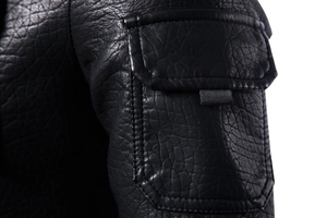 Detailed macro view of the motorcycle jacket side pocket with dual stitching and PU leather texture