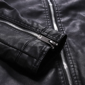 Close-up of high-quality pebbled black PU leather texture and silver metal zipper detail