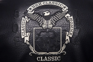 Detail shot of eagle embroidery and 1978 lettering on black biker leather jacket
