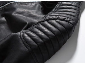 Macro detail of black PU leather motorcycle jacket showing quilted stitching and metal zipper