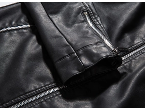 Detail of black PU leather jacket cuff featuring silver zipper and lychee grain texture