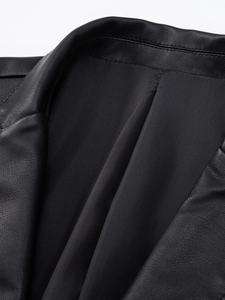 Close-up of premium black PU leather jacket lapel with fine stitching and smooth lining