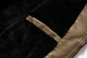 Detail of premium brown faux leather jacket with soft black fleece lining and metal zipper
