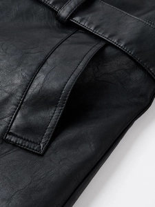 Detail of premium black PU leather texture with fine stitching and adjustable belt strap