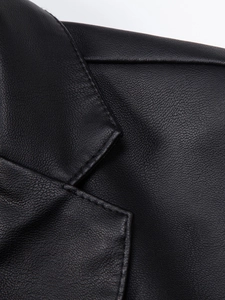 Close-up of black PU leather texture and neat stitching on male casual jacket lapel