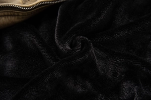 Detail shot of heavy black plush fleece lining and metallic zipper on men's leather jacket