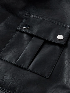 Detailed close-up of a black PU leather trench coat pocket with silver metal snap buttons