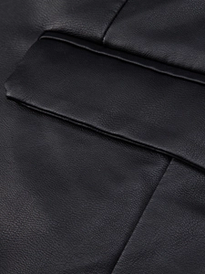 Close-up of black PU leather jacket showing fine grain texture and precision stitching detail